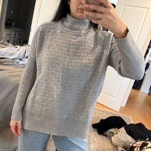 Novelty stitch sweater with funnel neck and split side hem